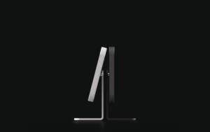 Side view of Homepad - smart home control tablet with sleek black and silver design.